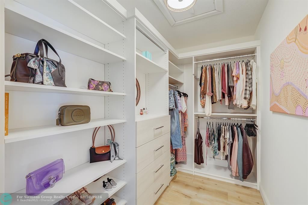 CUSTOM WALK IN CLOSET IN PRIMARY SUITE