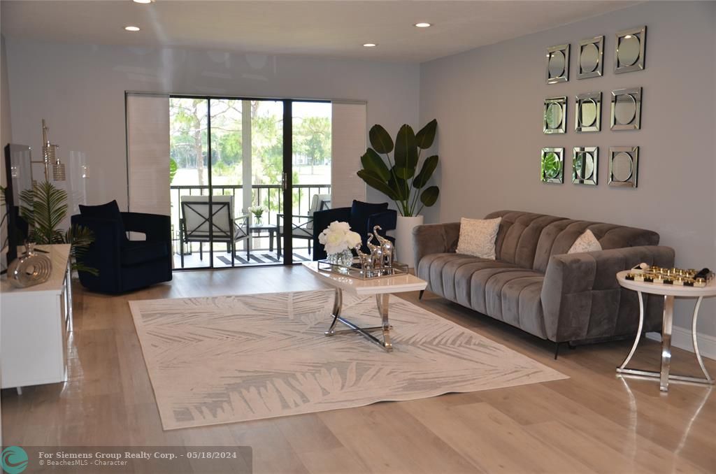 Entry to serene screened patio overlooking garden landscaping