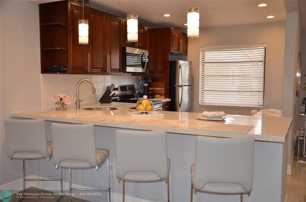 Remodeled open kitchen-quartz countertops