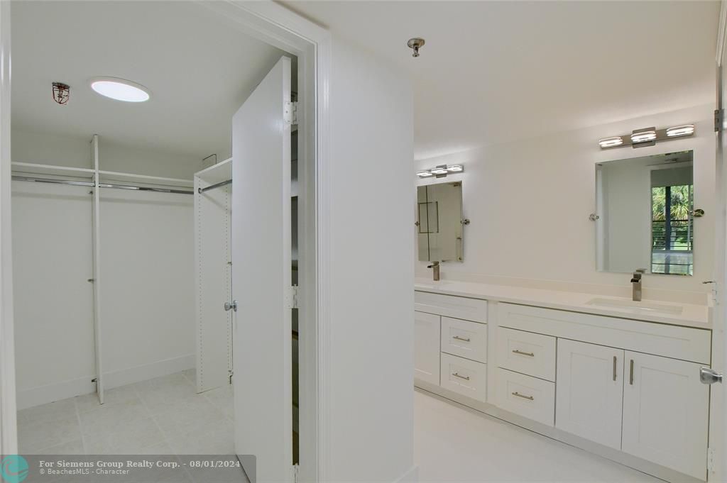 Walk In Closet with Custome Organization and En-Suite Master Bathroom!